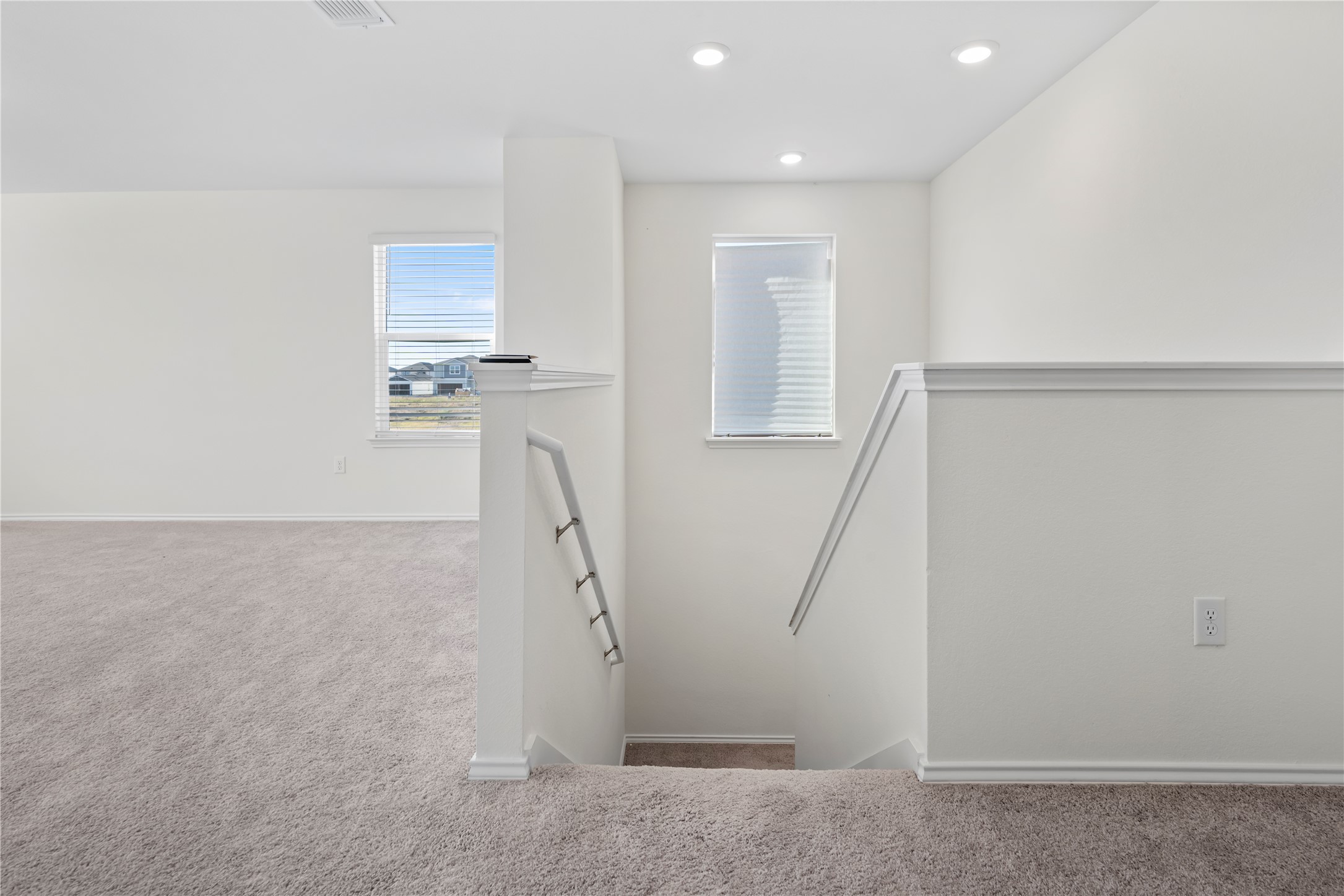 18501 Spotted Eagle Lane Elgin, TX 78621 - Photo 19 of 40 Stairway with carpet flooring and recessed lighting