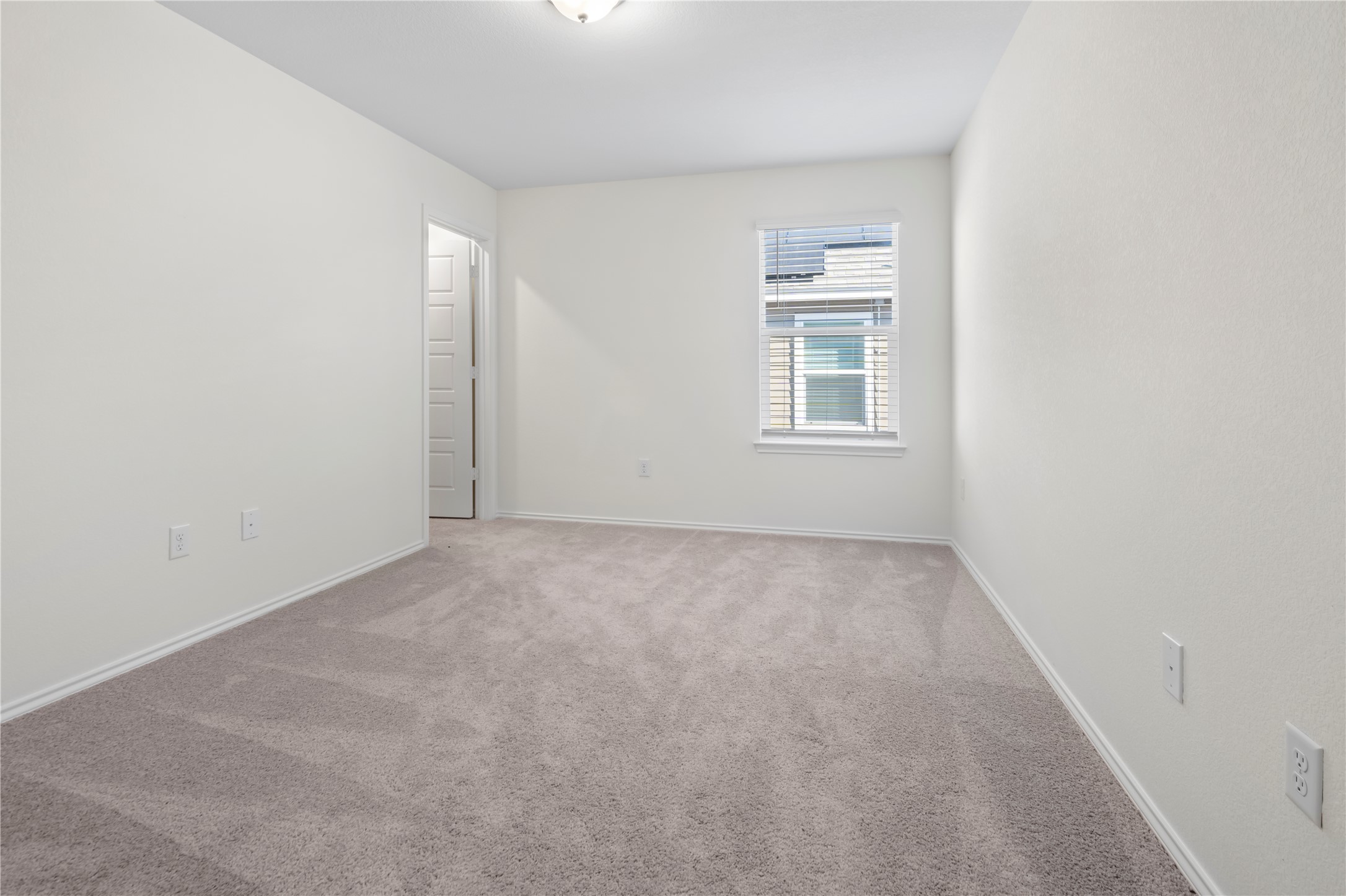 18501 Spotted Eagle Lane Elgin, TX 78621 - Photo 20 of 40 Carpeted spare room featuring baseboards