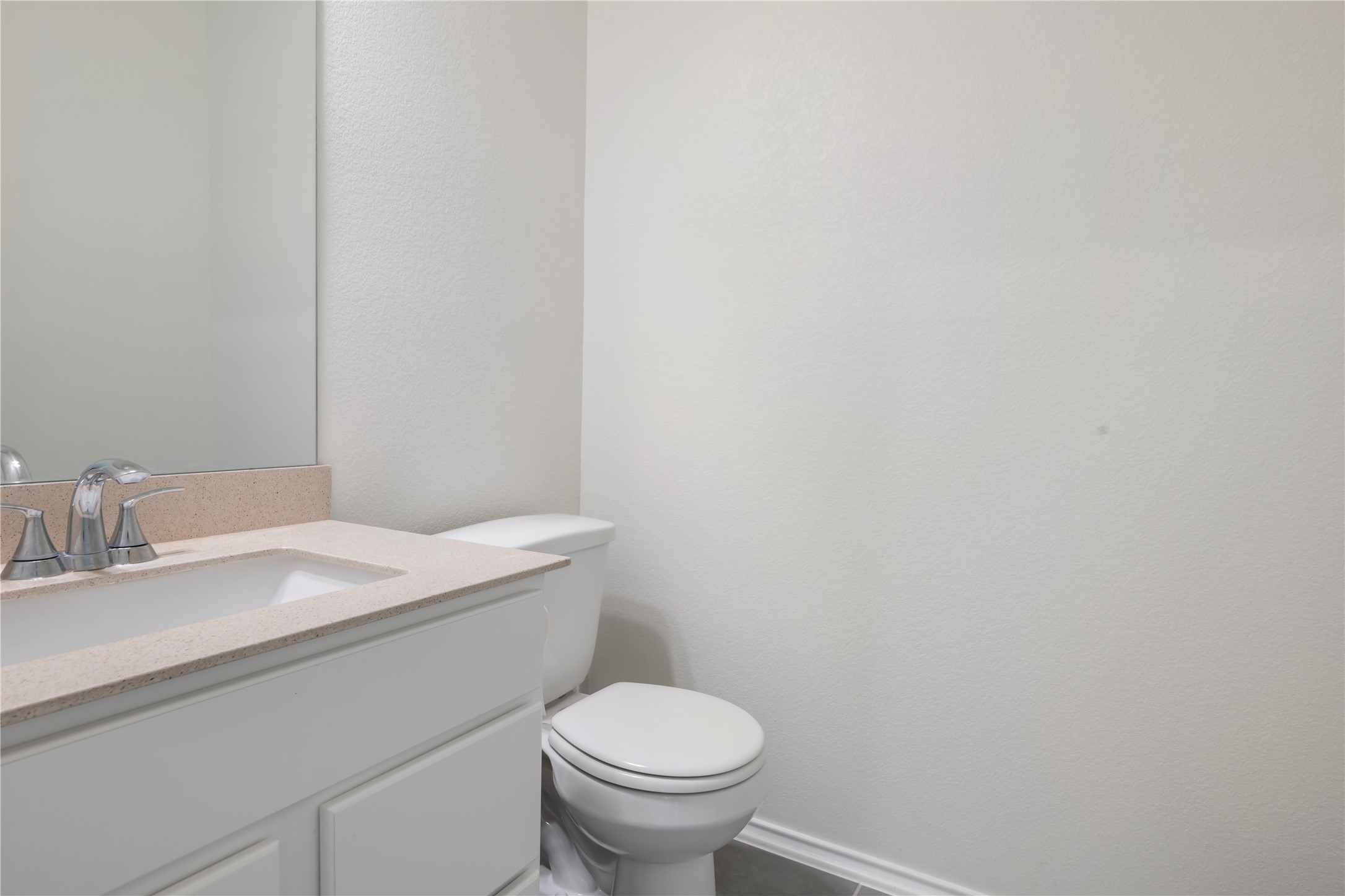 18501 Spotted Eagle Lane Elgin, TX 78621 - Photo 35 of 40 Half bathroom featuring vanity and a textured wall