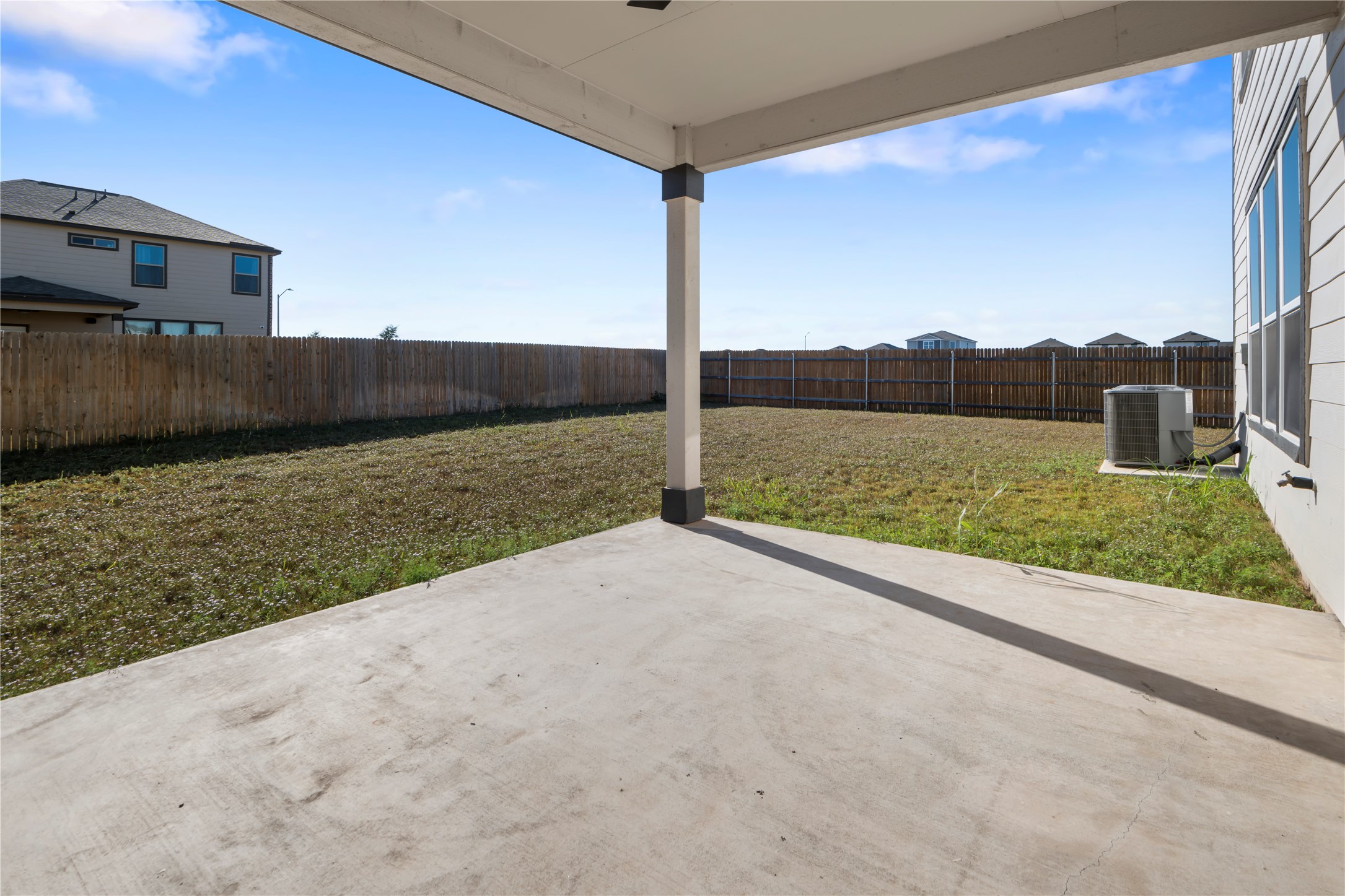 18501 Spotted Eagle Lane Elgin, TX 78621 - Photo 40 of 40 Fenced backyard featuring a patio