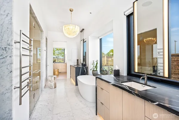 a bathroom with a bathtub and a shower
