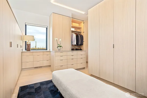 a room with kitchen island a white counter space and a sink