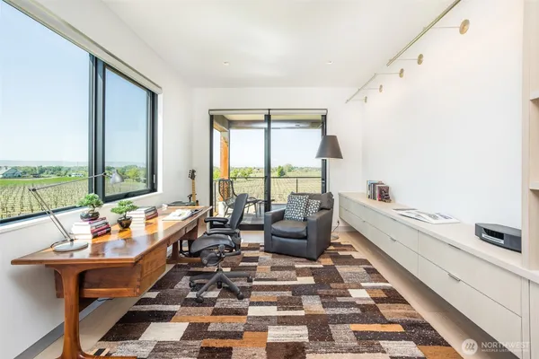 a living room with furniture and entry gate