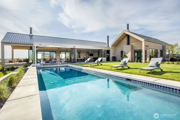 a view of a swimming pool with an ocean view