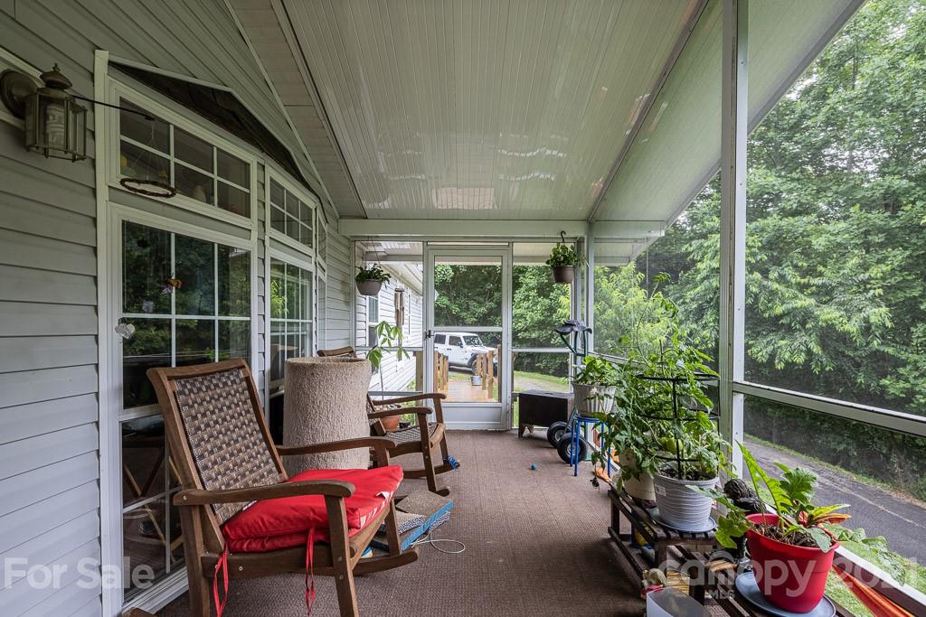 47 Integrity Mountain Otto, NC 28763 - Photo 13 of 22 a view of a chair and tables in the balcony