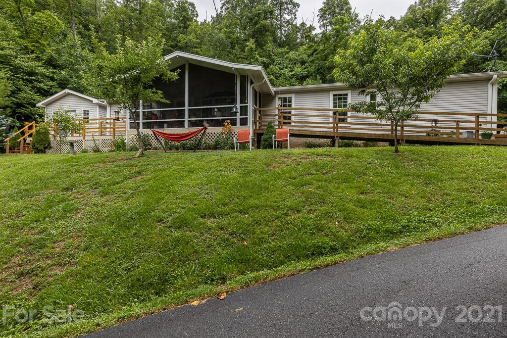 47 Integrity Mountain Otto, NC 28763 - Photo 20 of 22 a view of a house with backyard and wooden fence