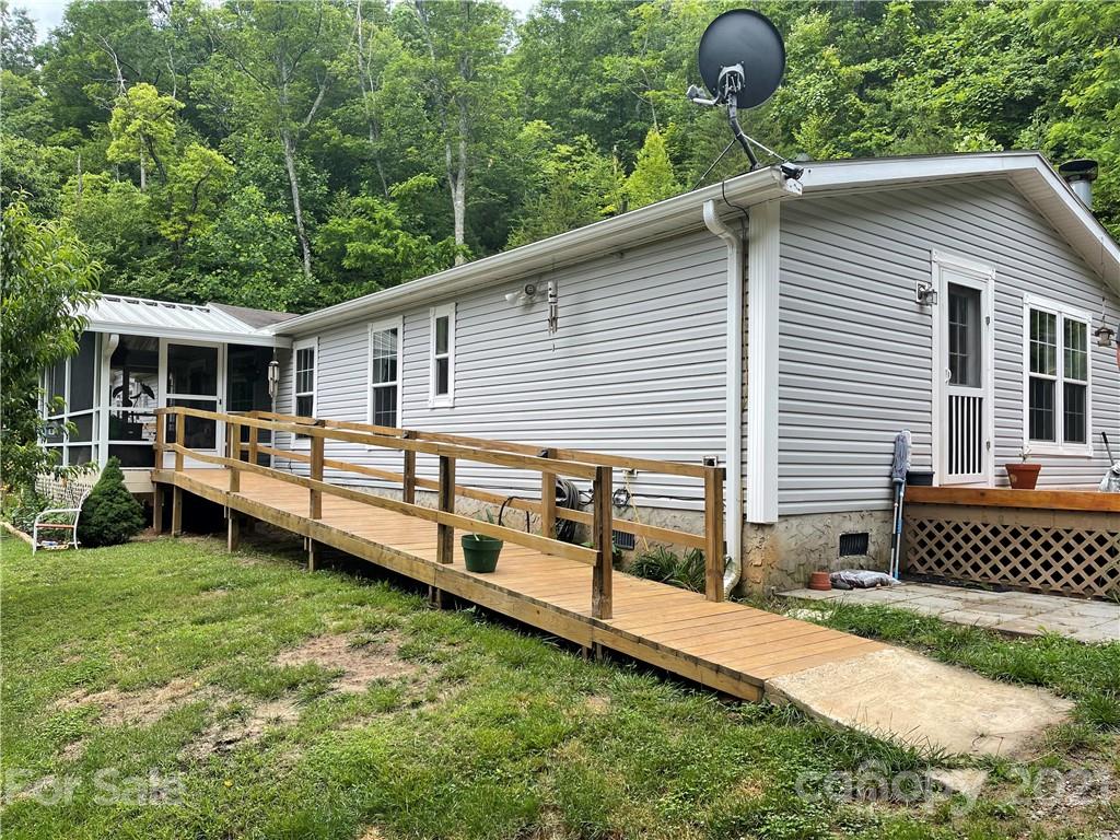 47 Integrity Mountain Otto, NC 28763 - Photo 3 of 22 a front view of a house with garden