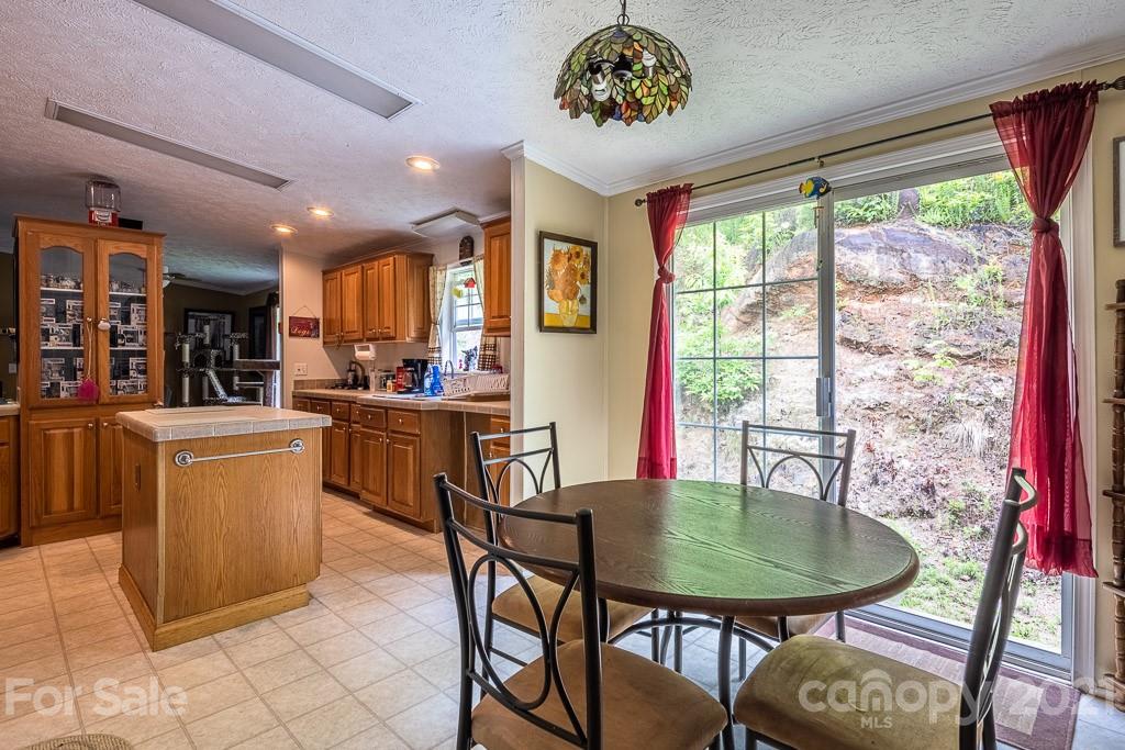 47 Integrity Mountain Otto, NC 28763 - Photo 5 of 22 a view of a dining room with furniture window and outside view