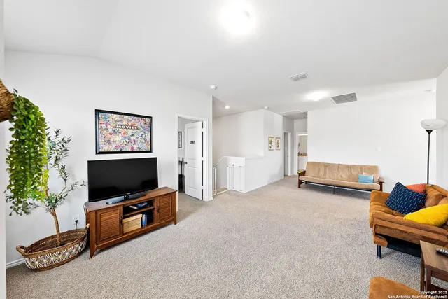 a view of a livingroom with furniture and window