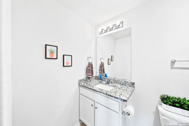 a view of a porch with furniture and garden