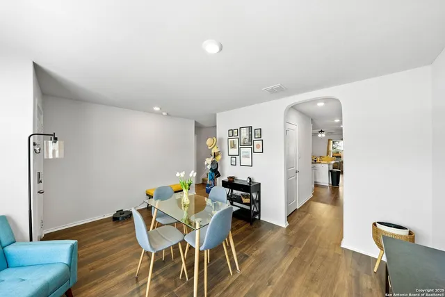 a view of a livingroom with furniture and wooden floor