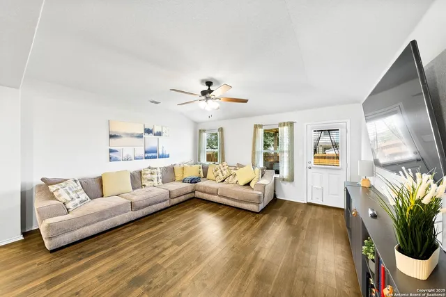 a living room with furniture and a large window