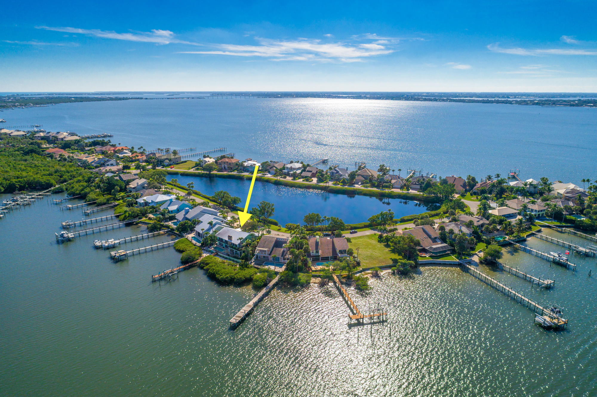 an aerial view of a houses with ocean view