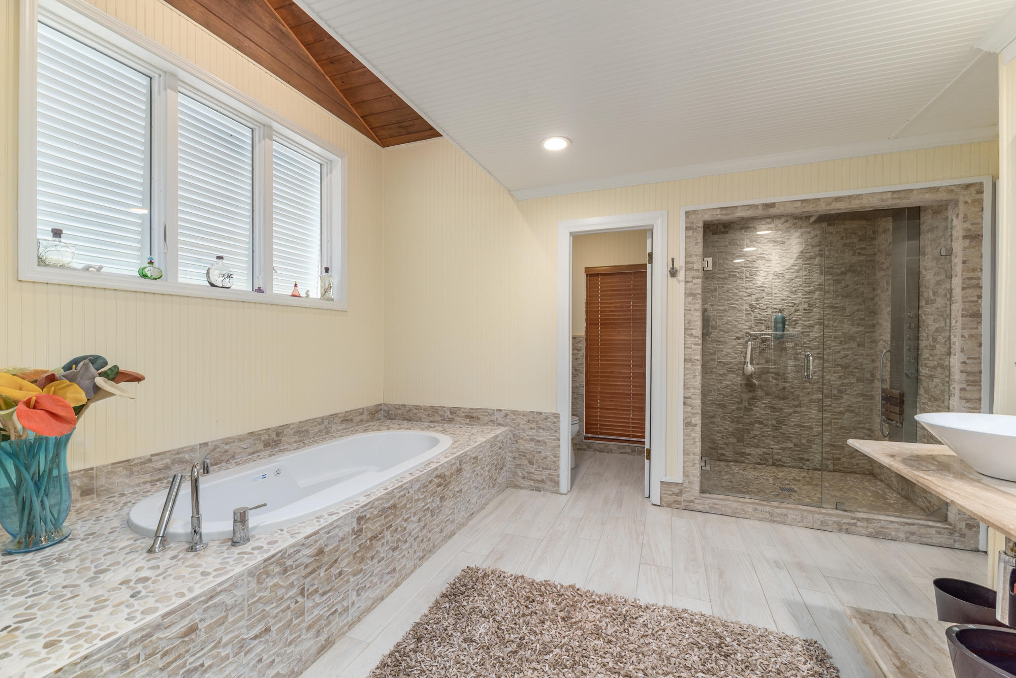 4040 Northeast Joes Point Road Stuart, FL 34996 - Photo 15 of 35 a bathroom with a tub and shower