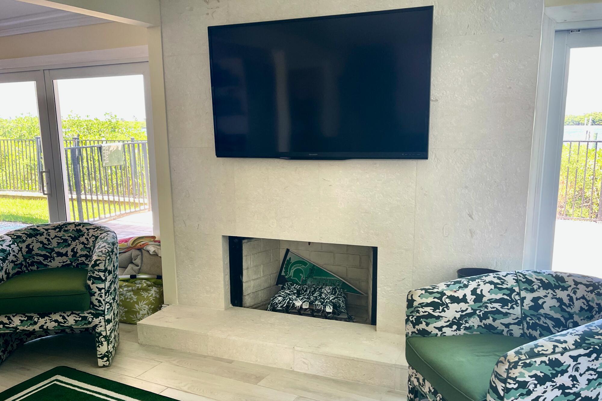 4040 Northeast Joes Point Road Stuart, FL 34996 - Photo 19 of 35 a bedroom with bed and window