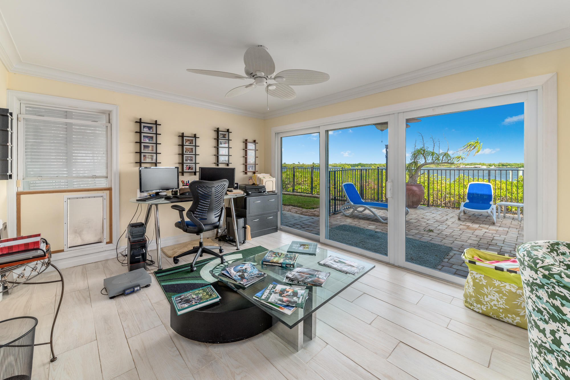 4040 Northeast Joes Point Road Stuart, FL 34996 - Photo 20 of 35 a living room with furniture and a flat screen tv