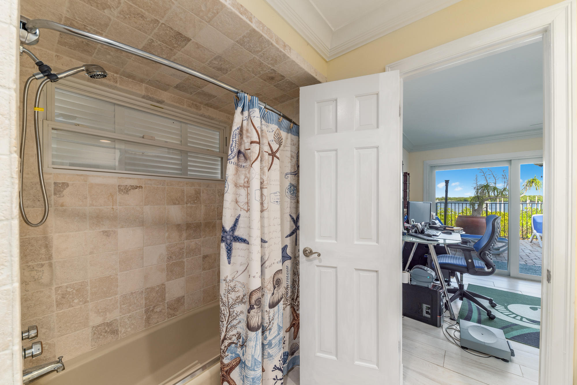 4040 Northeast Joes Point Road Stuart, FL 34996 - Photo 23 of 35 a view of a bathroom with a shower