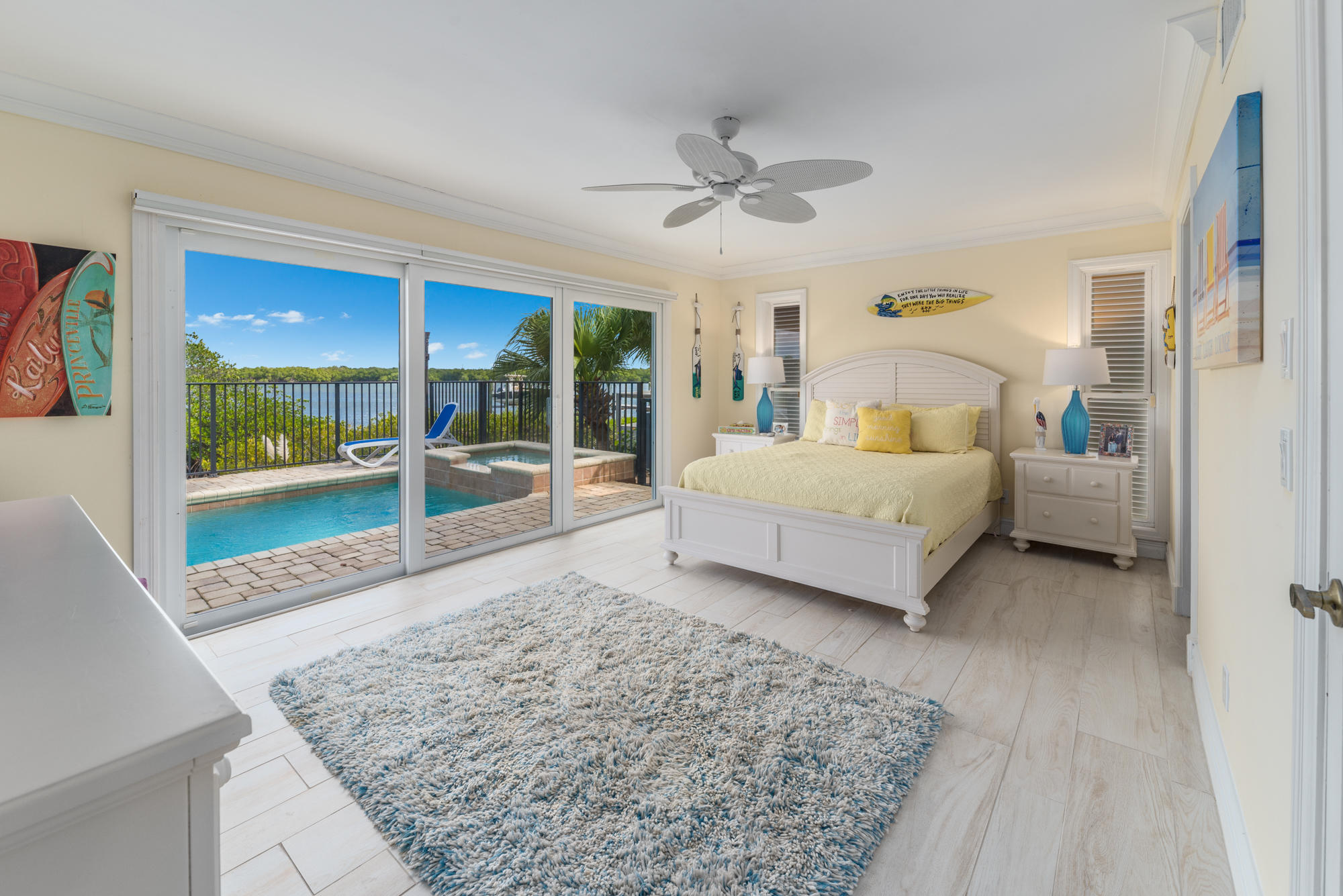 4040 Northeast Joes Point Road Stuart, FL 34996 - Photo 25 of 35 a living room with a bed and glass walk in closet
