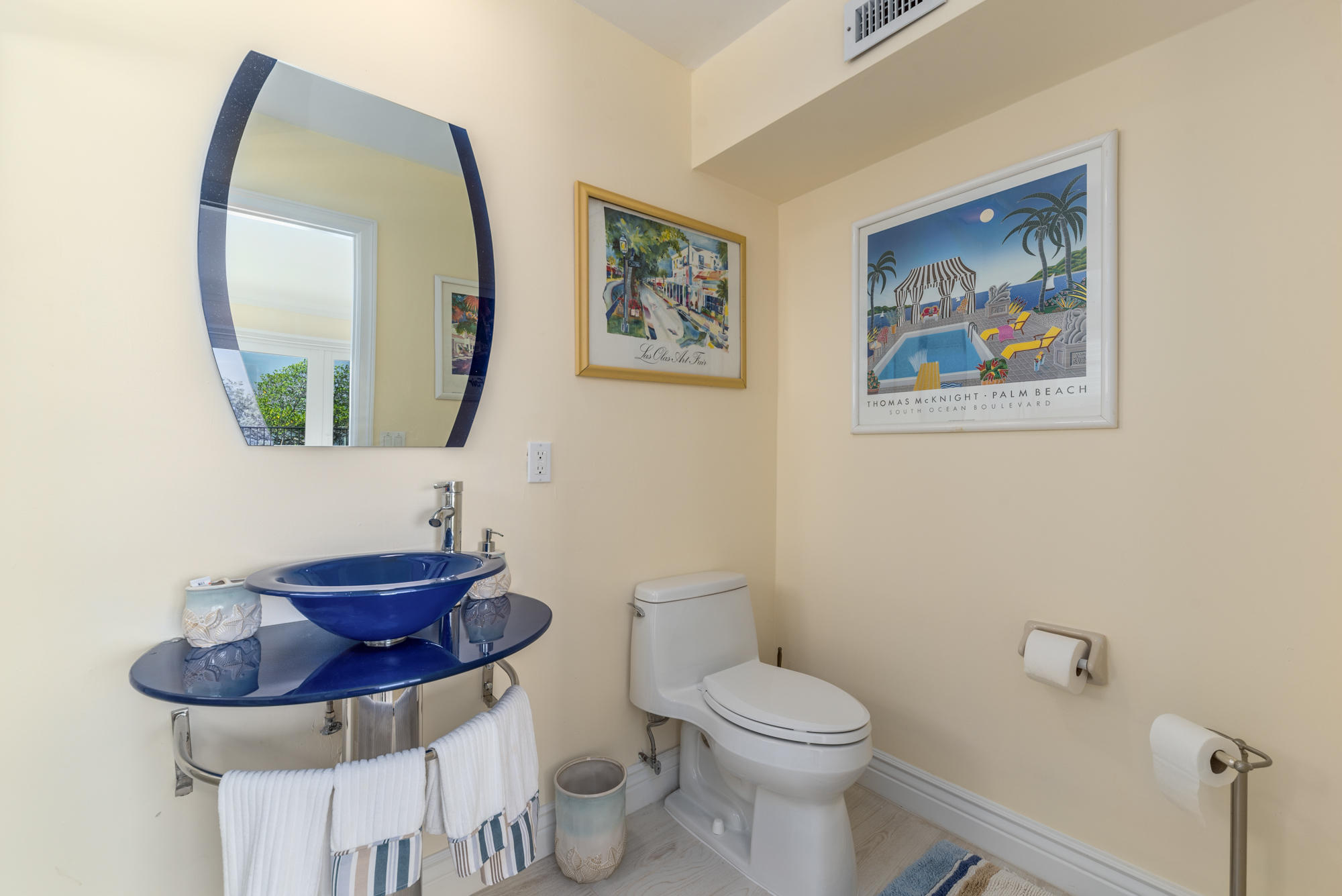 4040 Northeast Joes Point Road Stuart, FL 34996 - Photo 26 of 35 a bathroom with a toilet a sink and mirror