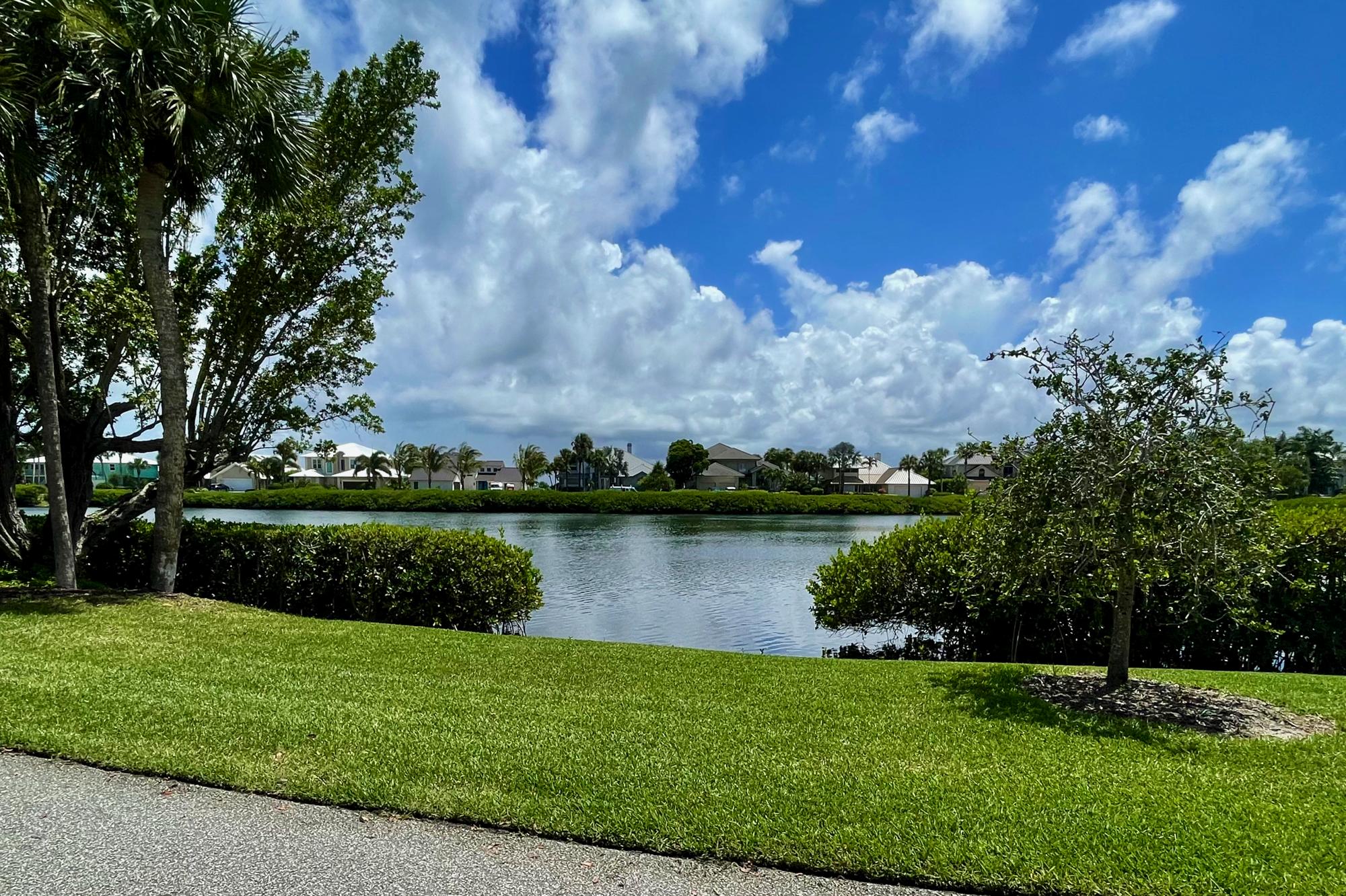 4040 Northeast Joes Point Road Stuart, FL 34996 - Photo 35 of 35 an aerial view of a house with a garden and lake view