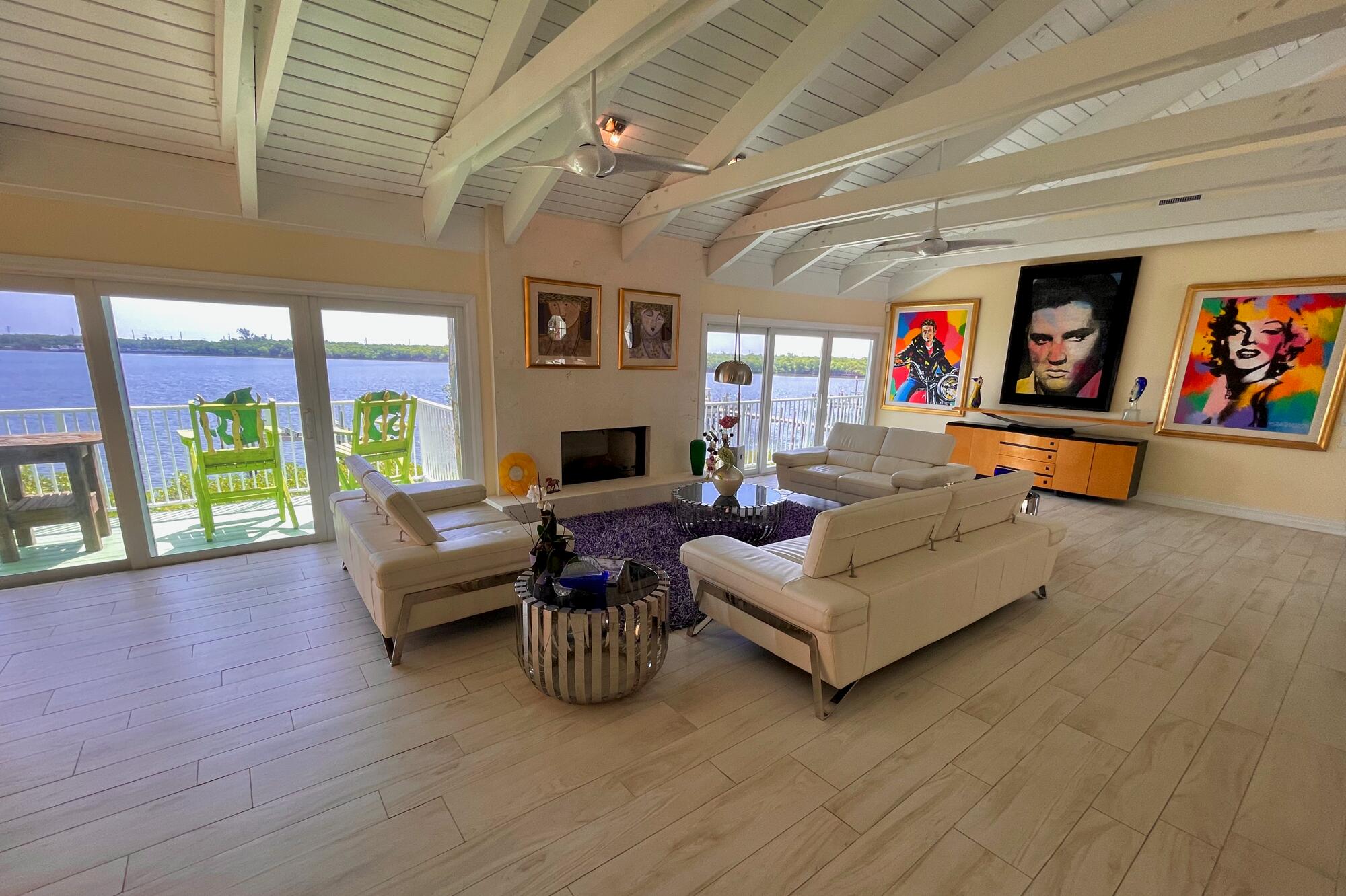4040 Northeast Joes Point Road Stuart, FL 34996 - Photo 7 of 35 a living room with furniture and a wooden floor