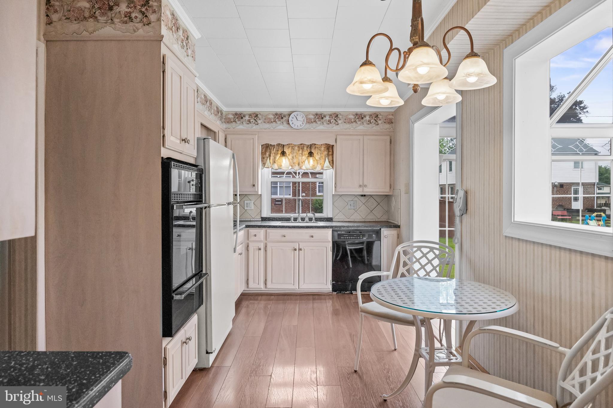 7 Colwick Road Cherry Hill, NJ 08002 - Photo 12 of 37 a kitchen with a refrigerator a sink and cabinets