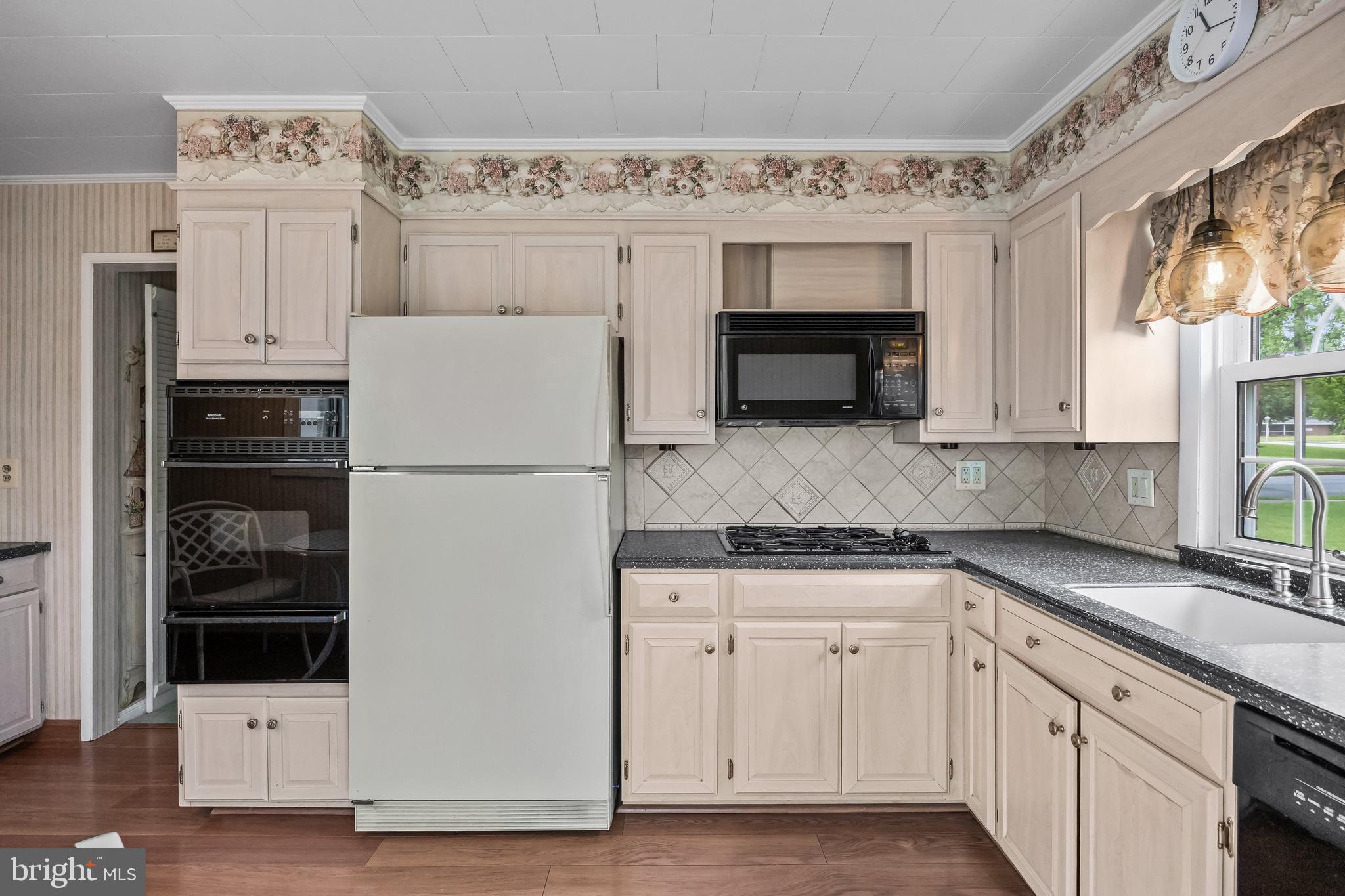 7 Colwick Road Cherry Hill, NJ 08002 - Photo 14 of 37 a kitchen with cabinets and refrigerator