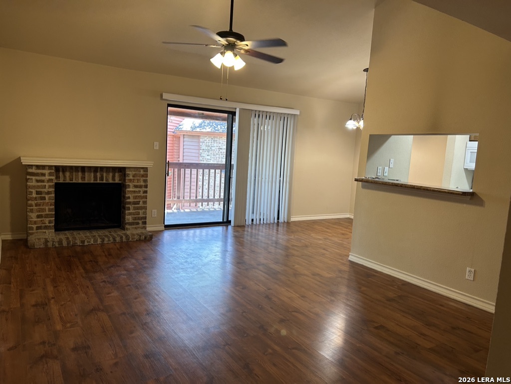 13018 Heimer Road, Unit 710 San Antonio, TX 78216 - Photo 6 of 27 a view of empty room with wooden floor and fan