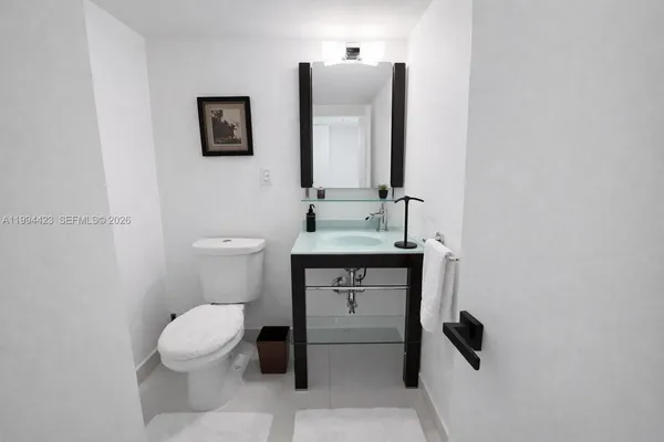 a view of a hallway with seating area