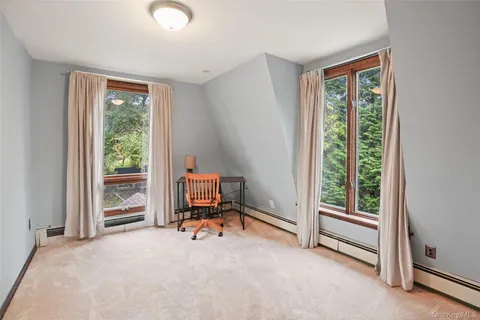 a view of room with workspace and a window