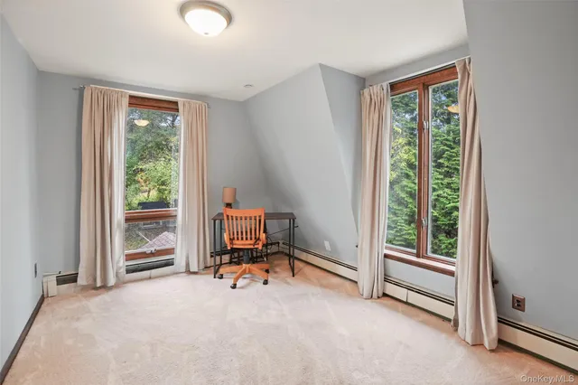 a view of room with workspace and a window