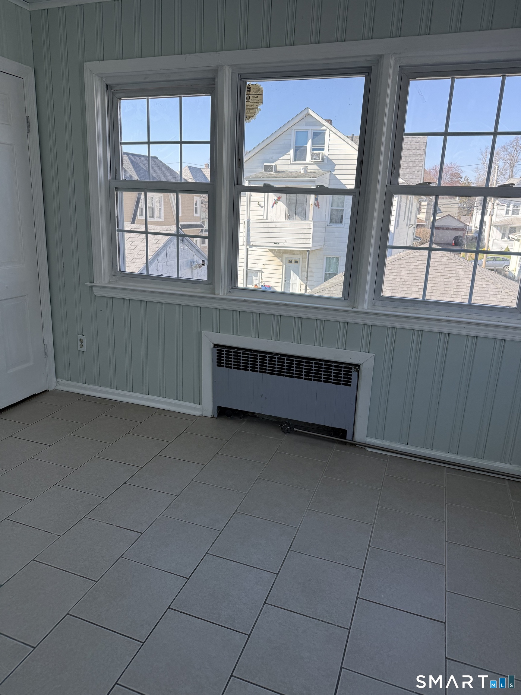95-97 Locust Street Bridgeport, CT 06610 - Photo 11 of 16 an empty room with windows
