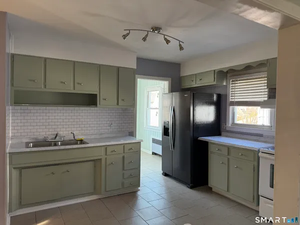 a kitchen with a sink and cabinets