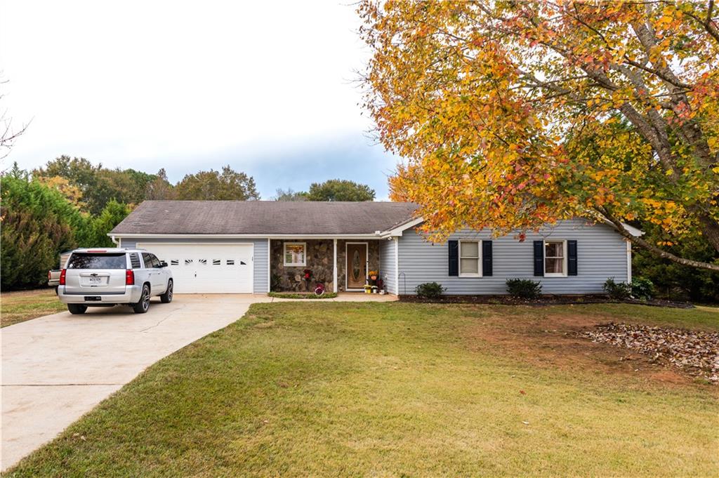 95 Newton Factory Bridge Road Covington, GA 30014 - Photo 1 of 1 a house view with a garden space
