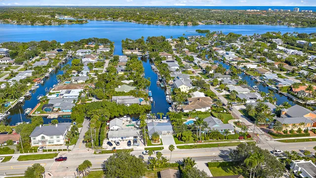 an aerial view of residential building with outdoor space and lake view