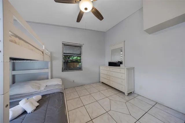 a room with a couch and white walls