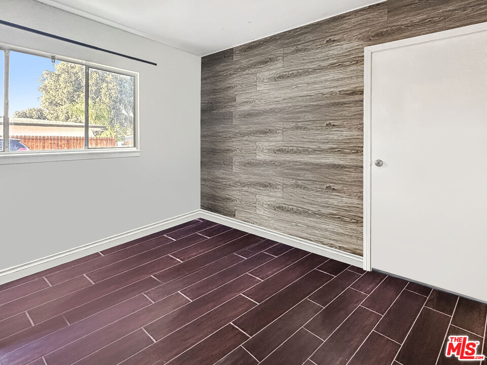 2944 Ronald Street Riverside, CA 92506 - Photo 18 of 37 a view of empty room with wooden floor and fan