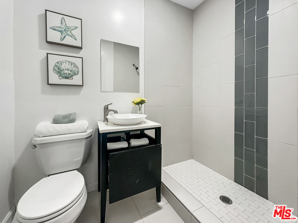 2944 Ronald Street Riverside, CA 92506 - Photo 30 of 37 a white toilet sitting next to a bathroom sink