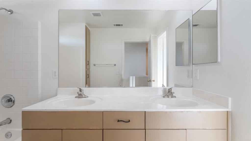 1428 Realty Road Ramona, CA 92065 - Photo 15 of 18 a bathroom with a sink and a mirror