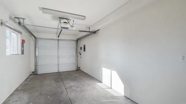 a view of a livingroom with a ceiling fan and window