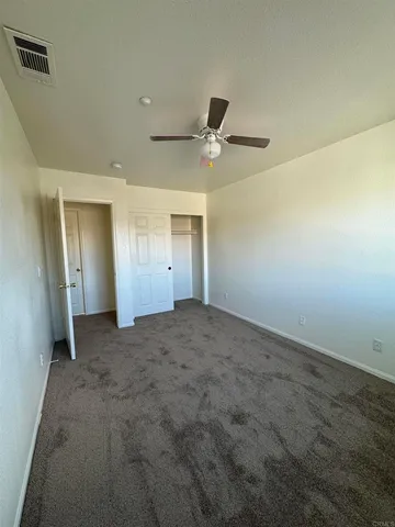 a view of a living room and a wooden floor