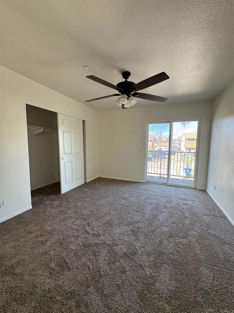 1428 Realty Road Ramona, CA 92065 - Photo 33 of 45 a view of a livingroom with a ceiling fan and window