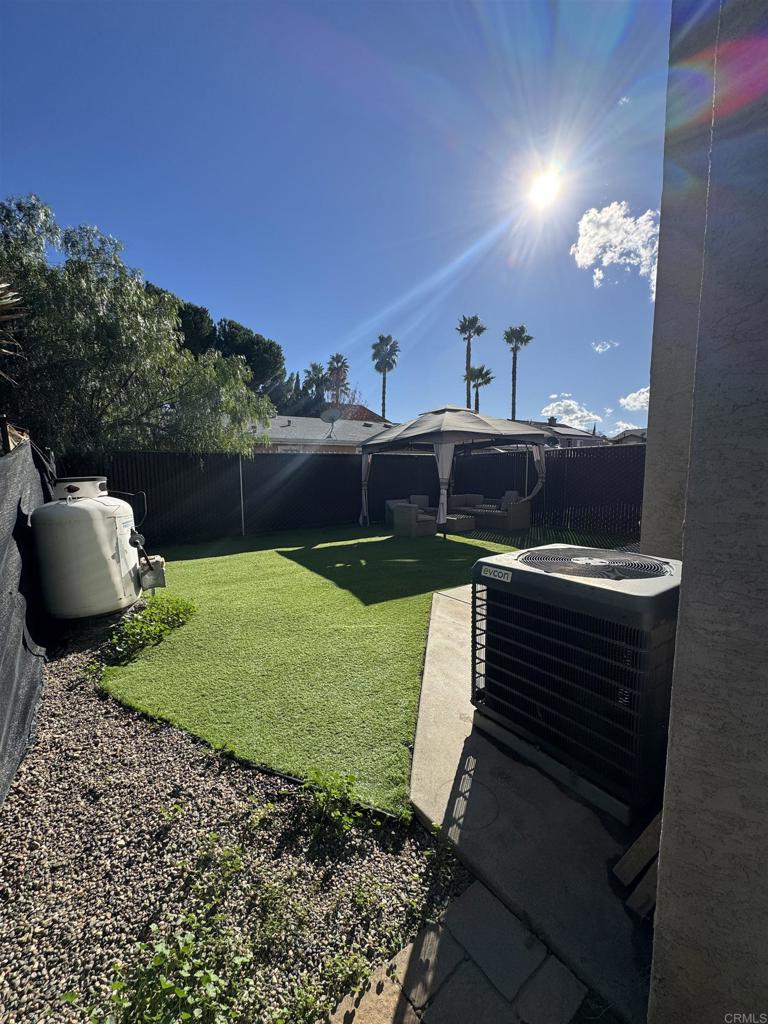 1428 Realty Road Ramona, CA 92065 - Photo 45 of 45 a view of a backyard with couches plants and large tree