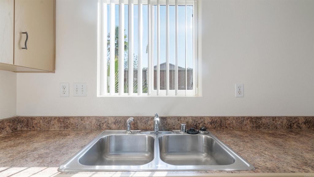1428 Realty Road Ramona, CA 92065 - Photo 5 of 18 a kitchen that has a sink and a window