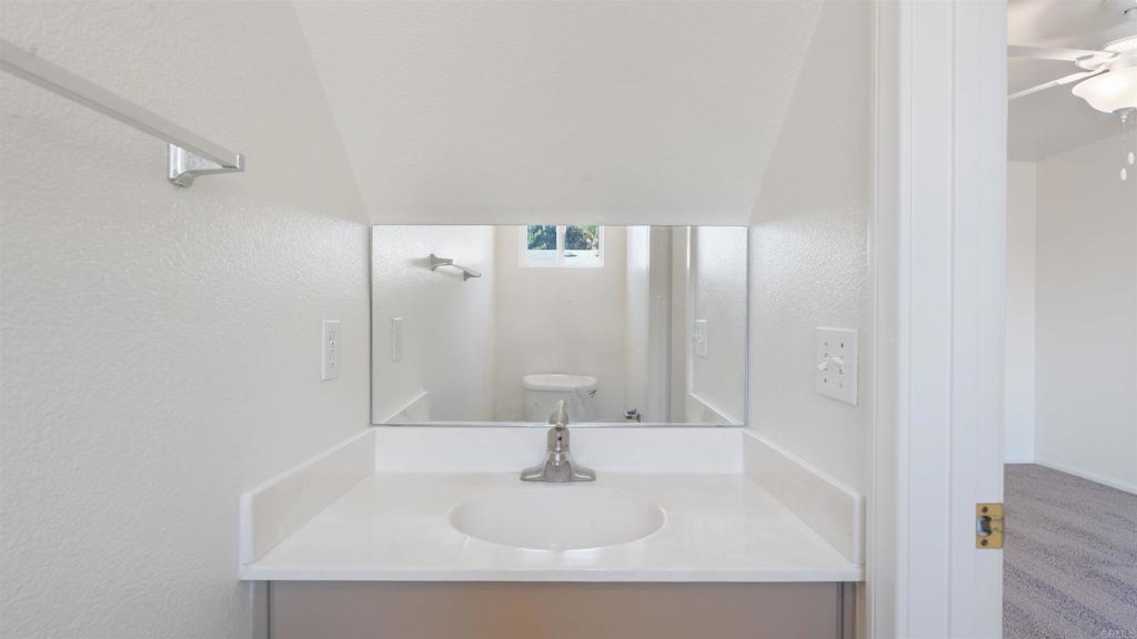 1428 Realty Road Ramona, CA 92065 - Photo 10 of 18 a bathroom with a sink and a mirror