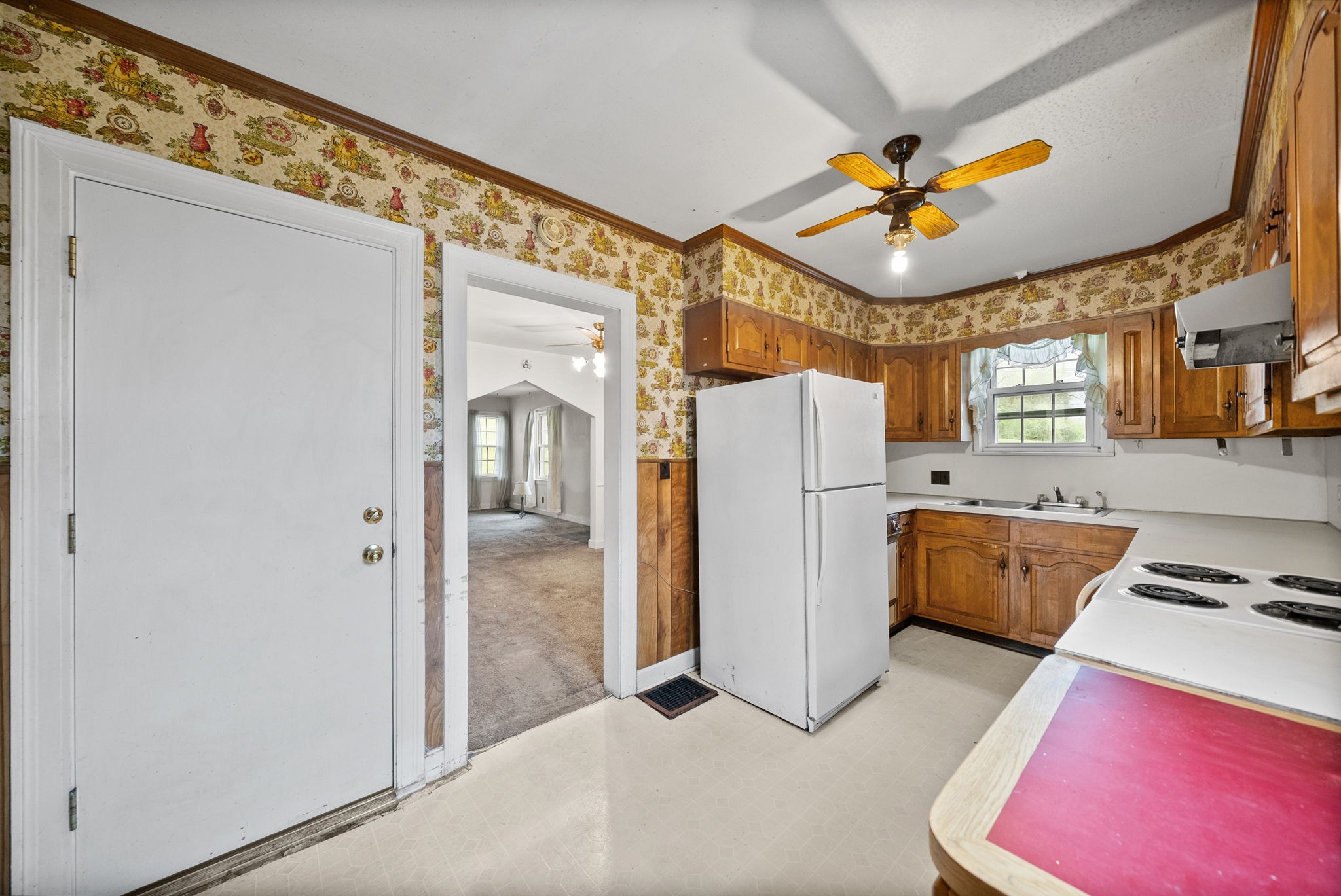 210 Cliffdale Road Nashville, TN 37214 - Photo 12 of 38 a view of a kitchen with a refrigerator and a ceiling fan