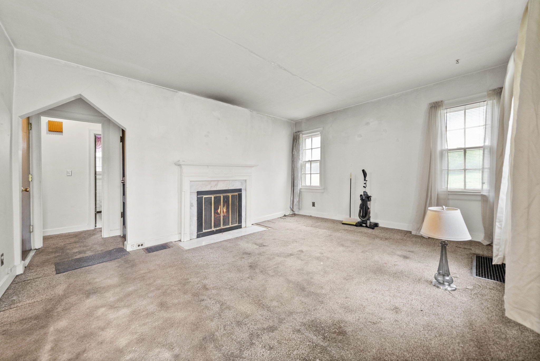 210 Cliffdale Road Nashville, TN 37214 - Photo 6 of 38 an empty room with windows and fireplace