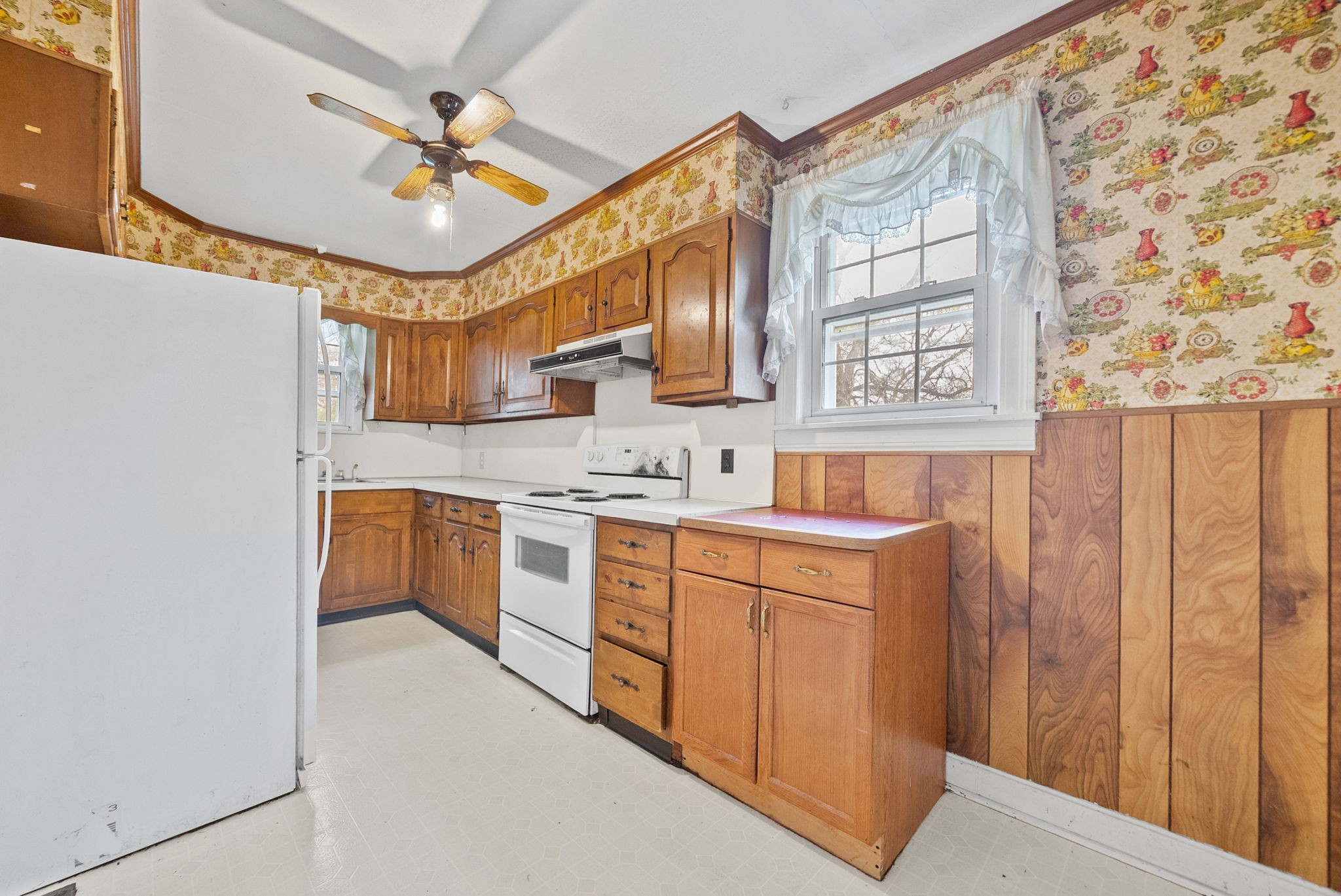 210 Cliffdale Road Nashville, TN 37214 - Photo 10 of 38 a kitchen with stainless steel appliances sink cabinets and window