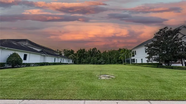 a view of a tree in front of a house
