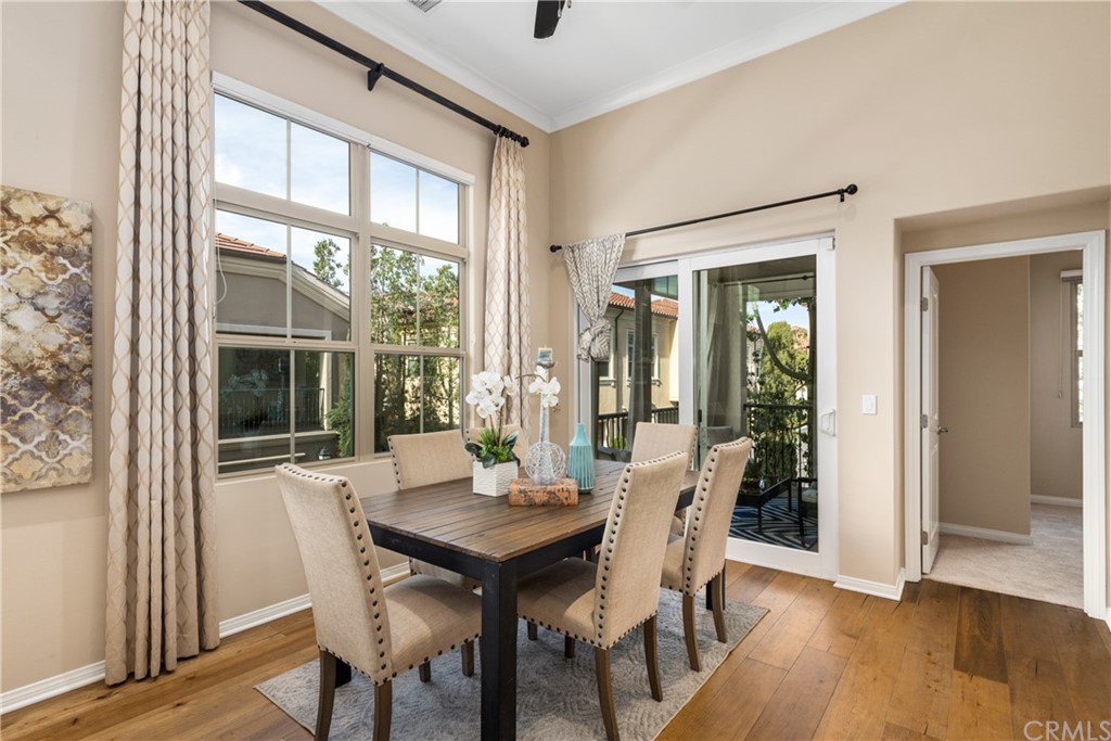 97 Mayfair Irvine, CA 92620 - Photo 15 of 42 a view of a dining room with furniture window and wooden floor